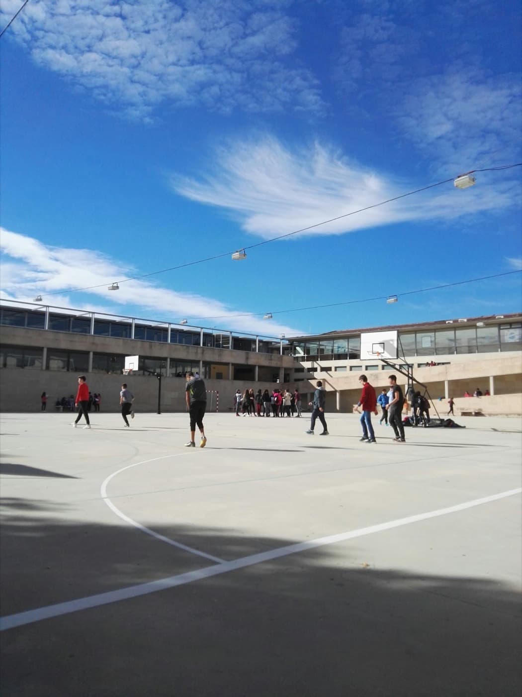 Basketball players on an outdoor court