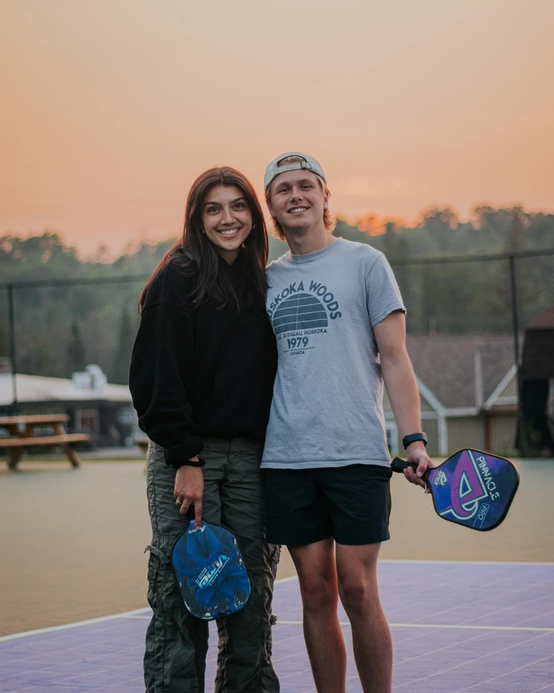 Pickleball players at sunset