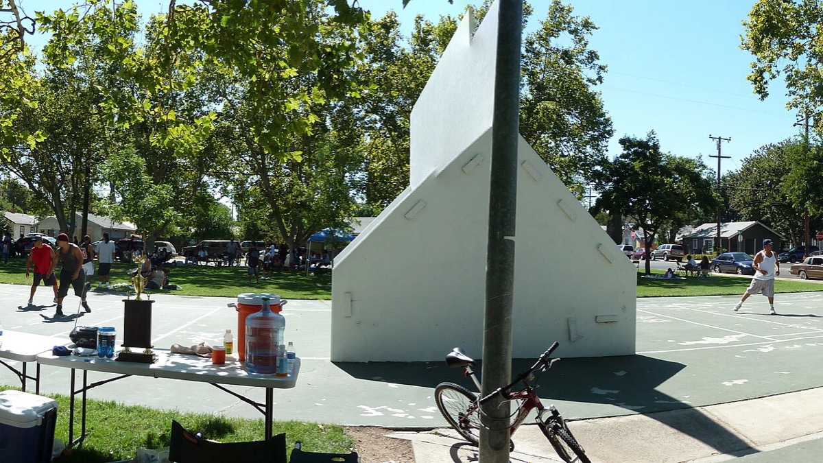 Players on outdoor one-wall handball courts at a California park